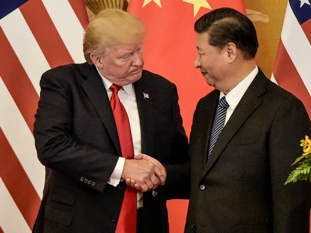 US President Donald Trump (L) shakes hand with China's President Xi Jinping at the end of a press conference at the Great Hall of the People in Beijing on November 9, 2017. Donald Trump and Xi Jinping put their professed friendship to the test on November 9 as the least …