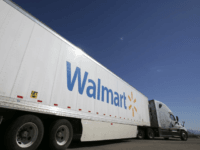 A Wal-Mart Stores Inc. tractor trailer truck departs the company's distribution center in Washington, Utah, U.S., on Friday, Sept. 23, 2016. The International Council of Shopping Centers is scheduled to release U.S. chain store sales figures on October 6. Photographer: George Frey/Bloomberg via Getty Images