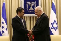 Israeli President Reuven Rivlin (R) shakes hands with Honduran President Juan Orlando Hernandez during a meeting at the presidential compound in Jerusalem, on October 29, 2015