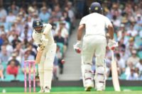 India's Cheteshwar Pujara plays a defensive shot with Mayank Agarwal at the non-striker's end on the first morning in Sydney