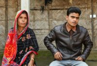 Saheb Ali (R), a survivor of an illegal coal mine flooding on December 13, said he had to fight to stop being dragged under the quickly rising water