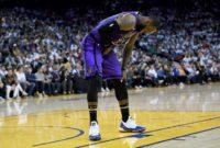 NBA star LeBron James, leaning over in pain after a groin injury, will be sidelined for another week before being re-evaluated, the Los Angeles Lakers said Friday