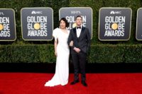 Sandra Oh (L) and Andy Samberg are hosting the Golden Globes