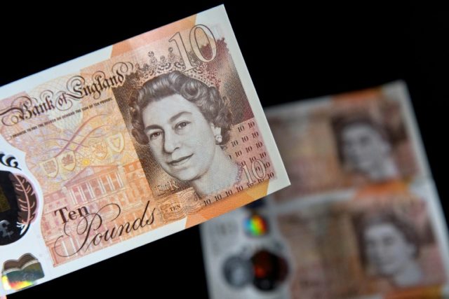 British pound rallies on May's Brexit setback; stocks gain