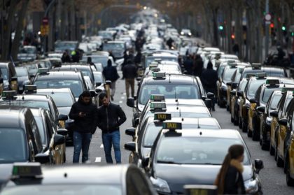 Barcelona taxis go on strike, block major street