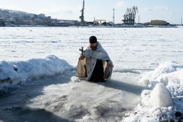 Russians dive into icy waters on Epiphany