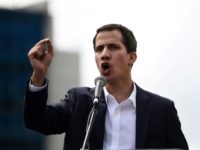 Venezuela's National Assembly head Juan Guaido speaks to the crowd during a mass opposition rally against leader Nicolas Maduro in which he declared himself the country's "acting president" US, S. American nations recognize Maduro opponent as interim leader