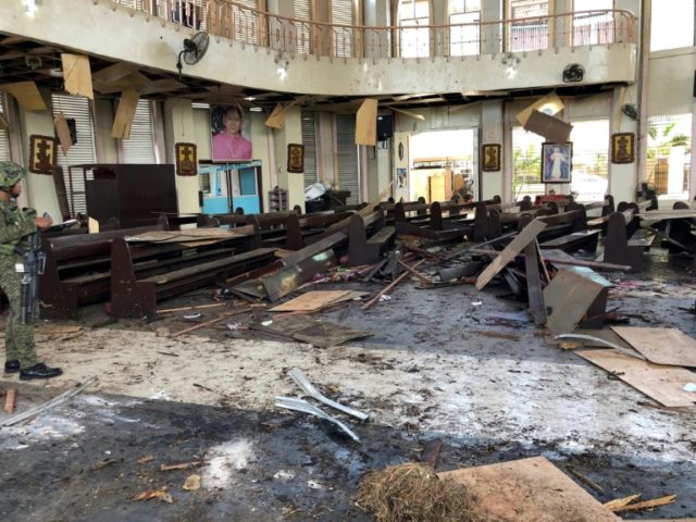 At least 18 killed in twin bomb attack on Philippine church