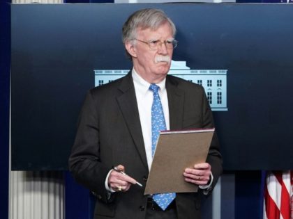 Bolton holds notepad saying: '5,000 troops to Colombia'