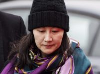 Canada China Huawei In this Dec. 12, 2018, file photo, Huawei chief financial officer Meng Wanzhou arrives at a parole office with a security guard in Vancouver, British Columbia. China on Tuesday, Jan. 22, 2019, demanded the U.S. drop a request that Canada extradite the top executive of the tech giant Huawei, shifting blame to Washington in a case that has severely damaged Beijing’s relations with Ottawa. (Darryl Dyck/The Canadian Press via AP, File) The Associated Press