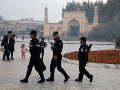 Security personnel near the Id Kah Mosque in Kashgar, in the Xinjiang region of China. Hundreds of thousands of Muslims in Xinjiang have been held in a network of indoctrination camps.CreditCreditNg Han Guan/Associated Press