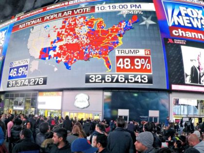 People watch election returns in Times Square on election night in 2016. After the exit polls appeared to be significantly off in that election, Fox News and the AP broke with other news organizations to start a new system. That could mean competing narratives of what happens on Election Day.