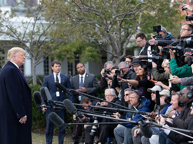 President Donald J. Trump talks with reporters along the South Lawn of the White House Wednesday, Oct. 31, 2018, prior to boarding Marine One to begin his trip to Fort Myers, Fla. (Official White House Photo by Joyce N. Boghosian)