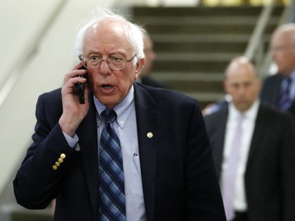Sen. Bernie Sanders, I-Vt., talks on his phone as he departs after a vote on Gina Haspel to be CIA director, on Capitol Hill, Thursday, May 17, 2018 in Washington. The Senate confirmed Haspel as the first female director of the CIA following a difficult nomination process that reopened an …