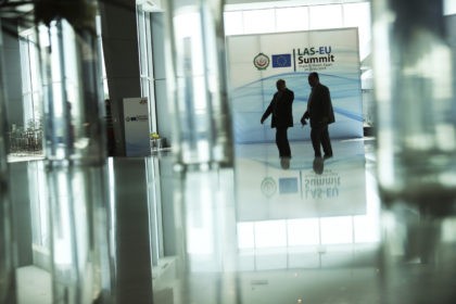 Security guards walk along the main hall of the Sharm El Sheikh convention centre in Sharm El Sheikh, Egypt, Saturday, Feb. 23, 2019. Leaders from the European Union and Arab countries are holding their first-ever summit aimed at deepening ties on migration, security and trade. (AP Photo/Francisco Seco)