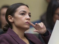 Rep. Alexandria Ocasio-Cortez, D-N.Y., listens to questions as Michael Cohen, President Donald Trump's former personal lawyer, testifies before the House Oversight and Reform Committee, on Capitol Hill, Wednesday, Feb. 27, 2019, in Washington. (AP Photo/Alex Brandon)