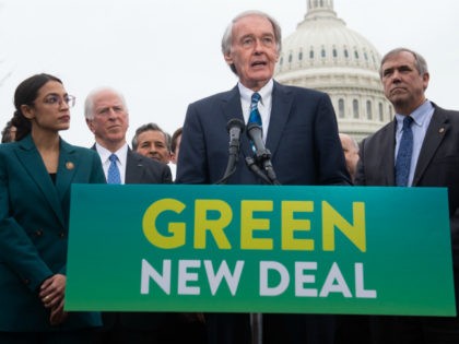 US Representative Alexandria Ocasio-Cortez, Democrat of New York, and US Senator Ed Markey (C), Democrat of Massachusetts, speak during a press conference to announce Green New Deal legislation to promote clean energy programs outside the US Capitol in Washington, DC, February 7, 2019. (Photo by SAUL LOEB / AFP) (Photo …
