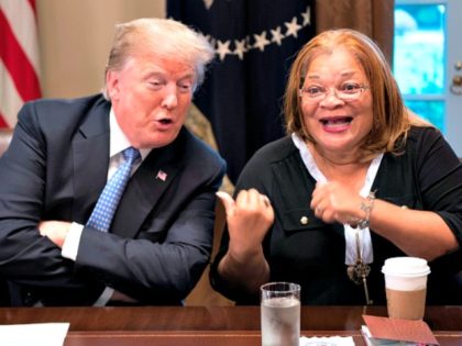 US President Donald Trump responds to Dr. Alveda King, niece of Dr. Martin Luther King Jr., during a meeting with inner city pastors at the White House in Washington, DC,on August 1, 2018. - President Trump delivered remarks at the roundtable discussion with several inner city pastors, and discussed the …