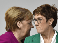 Annegret Kramp-Karrenbauer Angela Merkel TOPSHOT - German Chancellor Angela Merkel (L) walks past her successor, newly- elected leader of the Germany's conservative Christian Democratic Union (CDU) party Annegret Kramp-Karrenbauer during the CDU congress on December 8, 2018 at a fair hall in Hamburg, northern Germany. (Photo by John MACDOUGALL / AFP) (Photo credit should …
