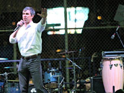 Former Democratic Rep. Beto O'Rourke speaks to a crowd inside a ball park across the