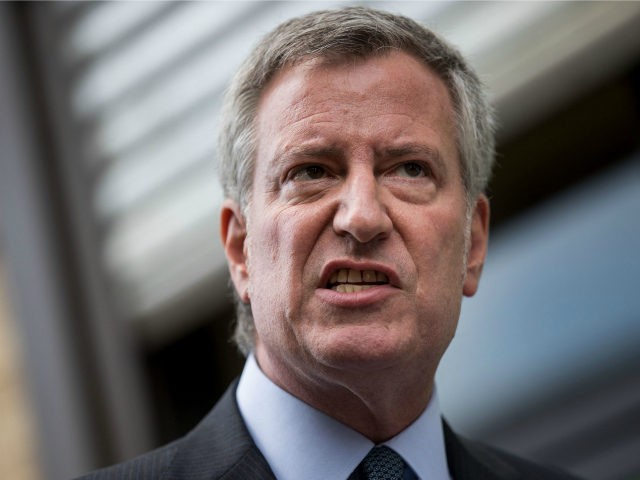 New York City Mayor Bill de Blasio speaks to the press following a visit to the Cayuga Cen