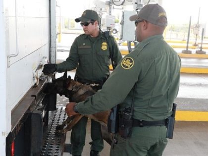 Border Patrol K-9 Checks Tractor-Trailer for suspected human smuggling activity. (Photo: U