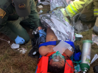 Border Patrol Rescue of Injured Migrants in Laredo Sector - 1 Laredo Sector Border Patrol agents provide medical assistance to an illegal alien who was struck by a truck while attempting to circumvent an immigration checkpoint. (Photo: U.S. Border Patrol/Laredo Sector)