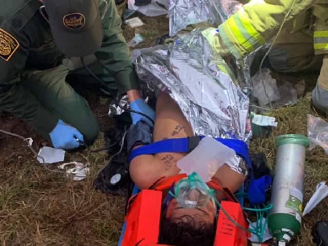 Laredo Sector Border Patrol agents provide medical assistance to an illegal alien who was struck by a truck while attempting to circumvent an immigration checkpoint. (Photo: U.S. Border Patrol/Laredo Sector)