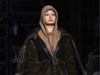 This Feb. 17, 2019 photo shows a model wearing a creation by Burberry at the Autumn/Winter 2019 fashion week runway show in London. The chief executive and chief creative officer of luxury powerhouse Burberry have apologized for putting a hoodie with strings tied in the shape of a noose on …