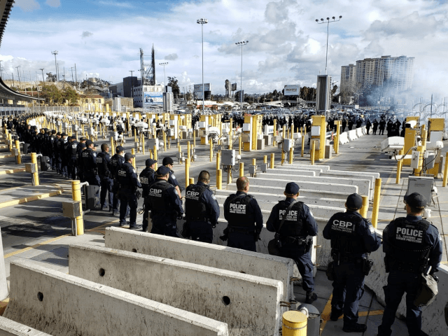 Large Group of Migrants Rush International Bridge, Assault CBP Officers