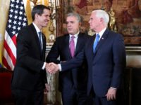 Venezuela's self-proclaimed interim president Juan Guaido, left, shakes with Vice President Mike Pence, after a meeting of the Lima Group concerning Venezuela at the Foreign Ministry in Bogota, Colombia, Monday, Feb. 25, 2019. Pence's appearance before the Lima Group comes two days after a U.S.-backed effort to deliver humanitarian across …