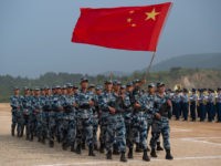 China-defense-military Chinese People's Liberation Army Air Force (PLAAF) personnel marching with their national flag during the opening ceremony of the International Army Games 2017 in Guangshui in China's central Hubei province.