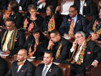 Members of Congress wear black clothing and Kente cloth in protest as US President Donald Trump delivers the State of the Union address in Washington, D.C.
