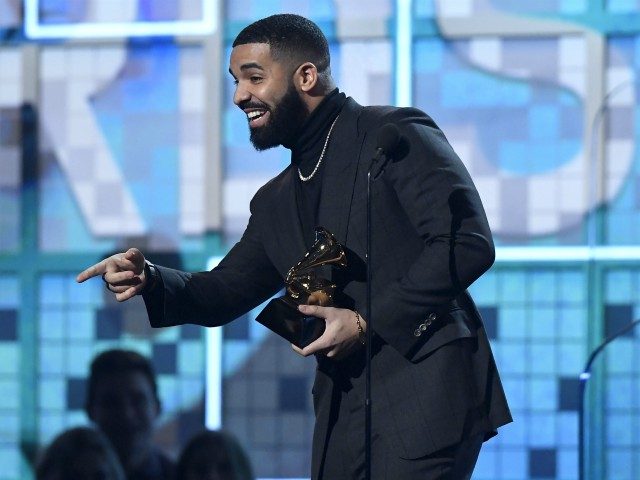 LOS ANGELES, CALIFORNIA - FEBRUARY 10: Drake accepts Best Rap Song for 'God's Pl