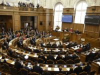 GettyImages-1044475194 Danish Prime Minister Lars Loekke Rasmussen (L) holds the opening speech of the parliament in Copenhagen, Denmark on October 2, 2018. (Photo by Liselotte Sabroe / Ritzau Scanpix / AFP) / Denmark OUT (Photo credit should read LISELOTTE SABROE/AFP/Getty Images)