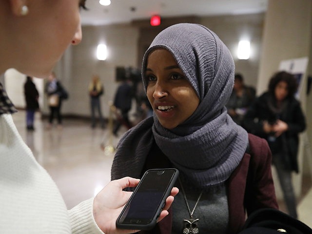WASHINGTON, DC - NOVEMBER 15: New member-elect Ilhan Omar (D-MN) talks to a reporter befor