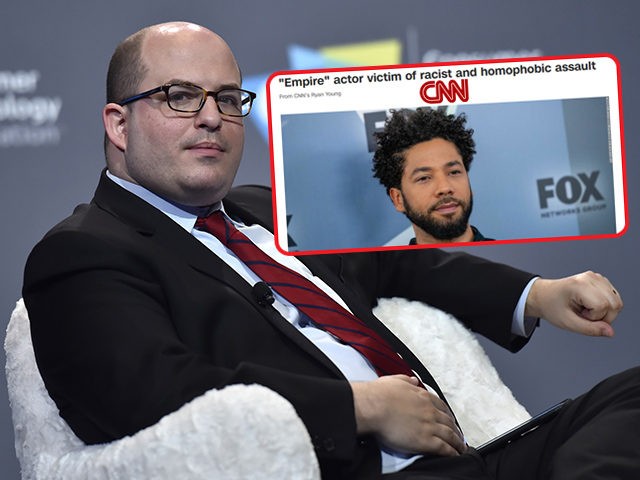 (INSET: CNN headline on Jussie Smollett) LAS VEGAS, NEVADA - JANUARY 09: CNN anchor and correspondent Brian Stelter speaks during a press event at CES 2019 at the Aria Resort