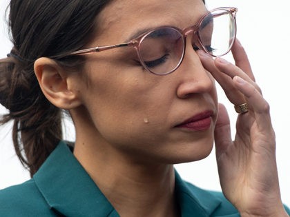 US Representative Alexandria Ocasio-Cortez, Democrat of New York, sheds a tear during a pr