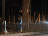 GettyImages-140308127 A prostitute waits for clients in the Bois de Boulogne, on March 2, 2012 in Paris. Twenty-five suspected prostitutes were arrested during an overnight anti-prostitution operation. AFP PHOTO / THOMAS SAMSON (Photo credit should read THOMAS SAMSON/AFP/Getty Images)