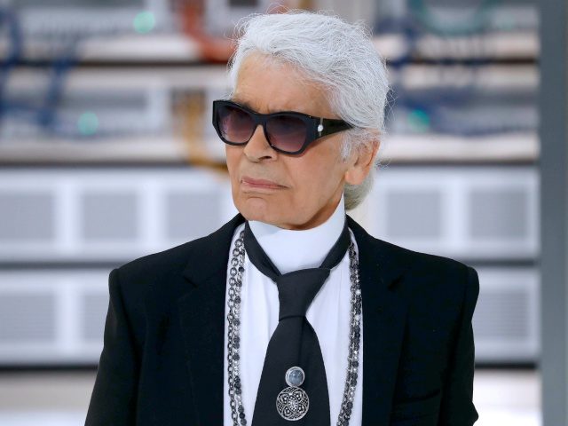 German fashion designer Karl Lagerfeld acknowledges the audience at the end of the Chanel