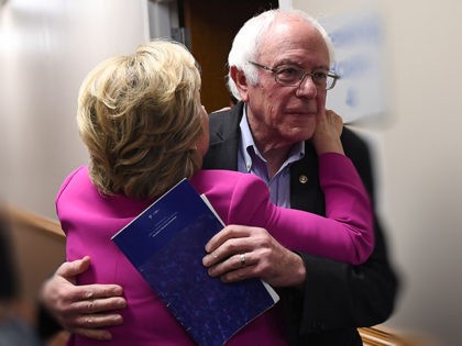 US Democratic presidential nominee Hillary Clinton embraces Bernie Sanders backstage befor