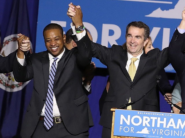 FAIRFAX, VA - NOVEMBER 07: Gov.-elect Ralph Northam (C) links arms with (L-R) current Gov.