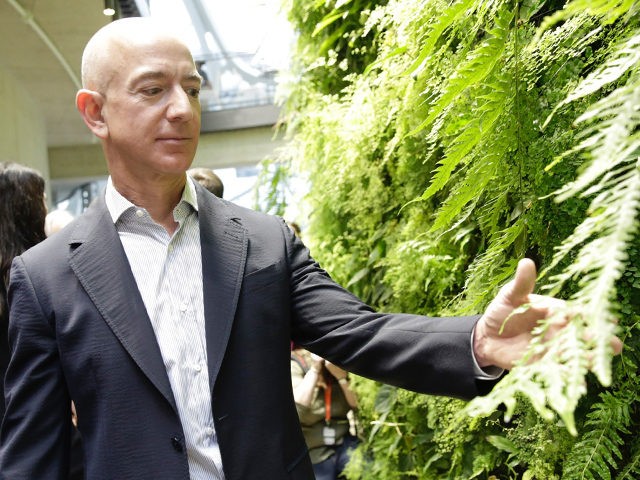 Chief Executive Officer of Amazon, Jeff Bezos, tours the facility at the grand opening of the Amazon Spheres, in Seattle, Washington on January 29, 2018.  Amazon opened its new Seattle office space which looks more like a rainforest. The company created the Spheres Complex to help spark employee creativity. / …