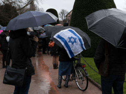 People take part in a slient march in Strasbourg, eastern France on March 28, 2018, in mem