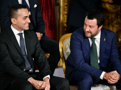 Italys Labor and Industry Minister and deputy PM Luigi Di Maio (L) and Italys Interior Minister and deputy PM Matteo Salvini smile before the swearing in ceremony of the new government at Quirinale Palace in Rome on June 1, 2018. - Italian cabinet members of the new government led by …