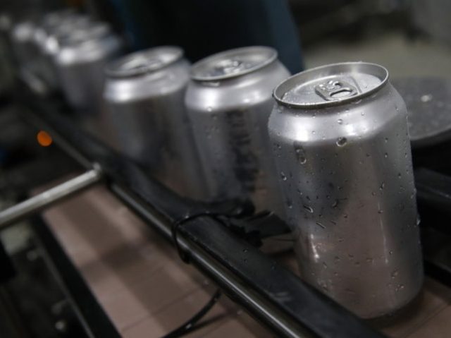 SAN CARLOS, CA - JUNE 06: Freshly canned beers move on an assembly line at Devil's C