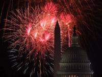 WASHINGTON, DC - JULY 04: The U.S. Capitol and the Washington Monument are seen as fireworks explode above the nation's capital on Independence Day July 4, 2018 in Washington, DC.