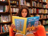 Girl reading Dr. Seuss Girl reading Dr. Seuss