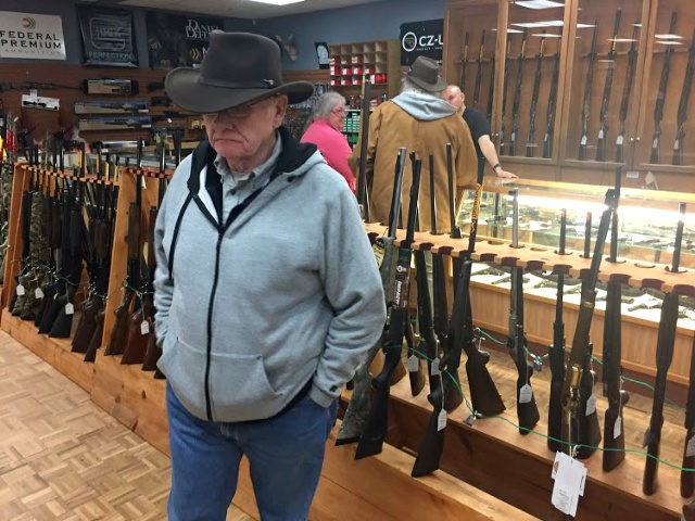 Retired computer programmer and firearms enthusiast Cephas Wright peruses the wares at The Outdoorsman gun shop in Santa Fe, N.M.