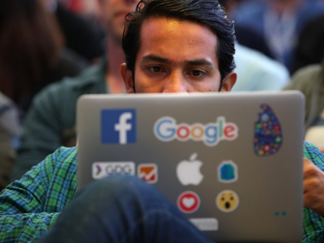 MOUNTAIN VIEW, CA - MAY 08: An attendee works on a laptop before the start of the Google I/O 2018 Conference at Shoreline Amphitheater on May 8, 2018 in Mountain View, California. Google's two day developer conference runs through Wednesday May 9. (Photo by Justin Sullivan/Getty Images)